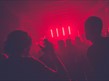 Dancing in red lit night club