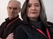 Image of a man and woman dressed in black