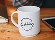Photo of a coffee cup and mobile phone
