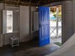 photo of house door opening onto a beach