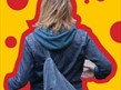 an image of a woman from behind against a yellow background with red spots