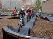 kids on bikes on the pump track