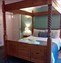 A four-poster bed in a bedroom.