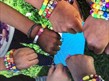 picture of children wrists with homemade bracelets