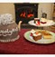 Cakes and tea pot with knitted wooley t cosy
