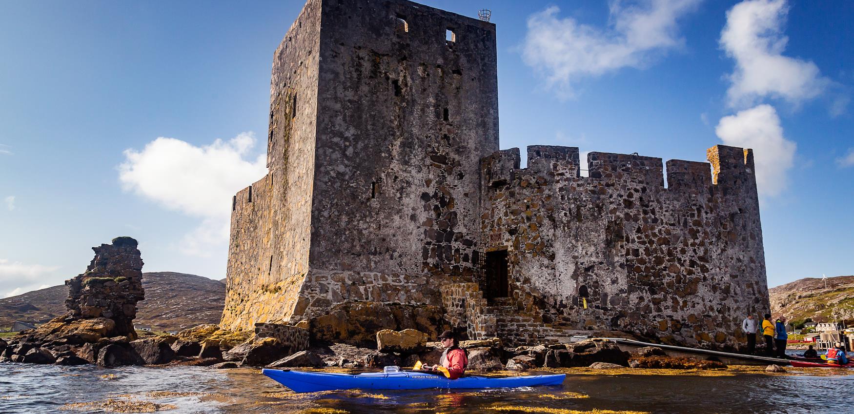 Kayaker at Kisimul Castle, Barra