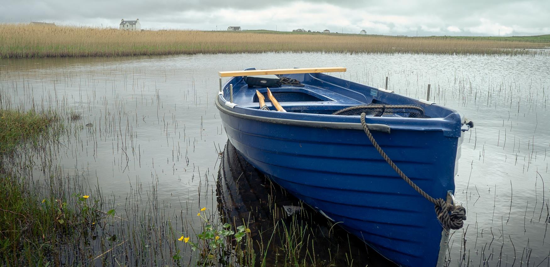 Fishing boat in loch in North Uist