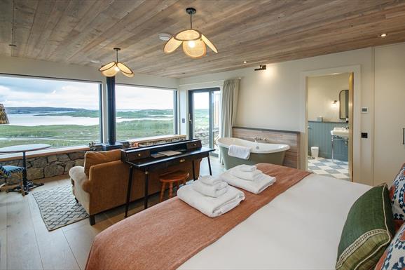 Uig Sands Rooms Luxury Apartment bedroom with bath, sofa and sea views