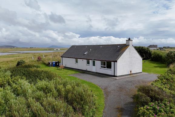 Am Bliochan self catering cottage north uist - aerial image with loch view