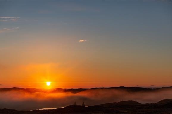 Long Island Retreats sunrise over misty loch