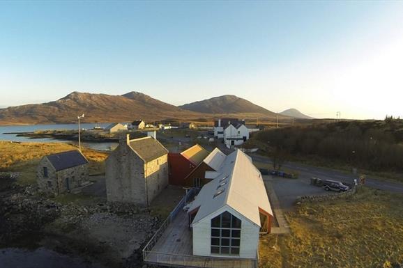 Aerial photo of the Taigh Chearsabhagh building, looking towards Lochmaddy Pier and Lee.