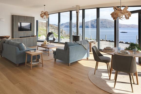 Harris Hideaway - living and dining area with expansive windows with sea view