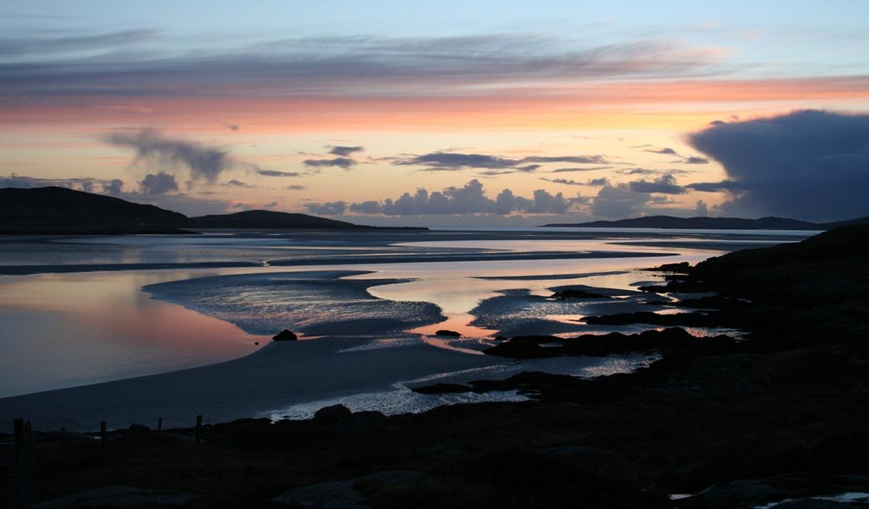 Looking out to Taransay at sunset