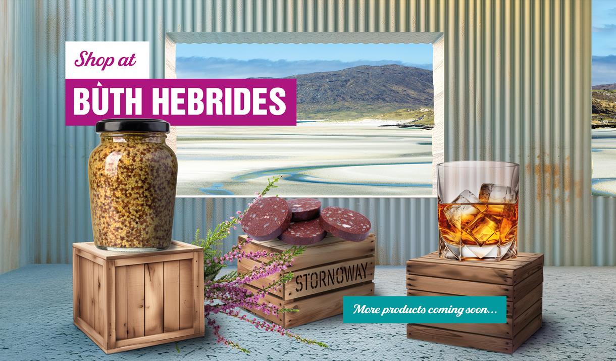 Buth Hebrides image of products in shop with a window of a view of the beach