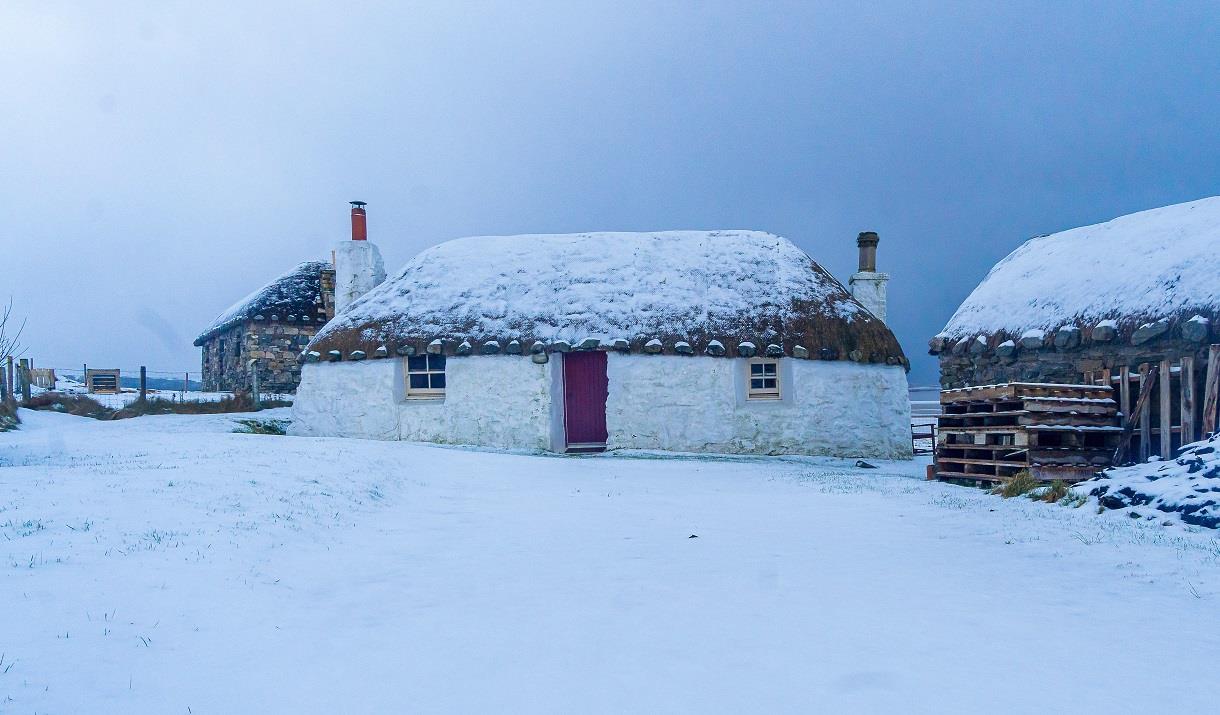 Thatched cottage in the snow