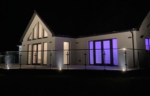 Skipper's Retreat house lit up at night