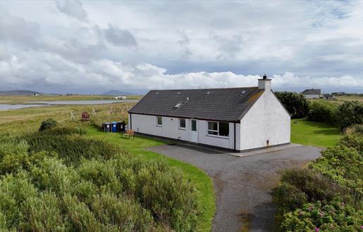 Am Bliochan self catering cottage north uist - aerial image with loch view