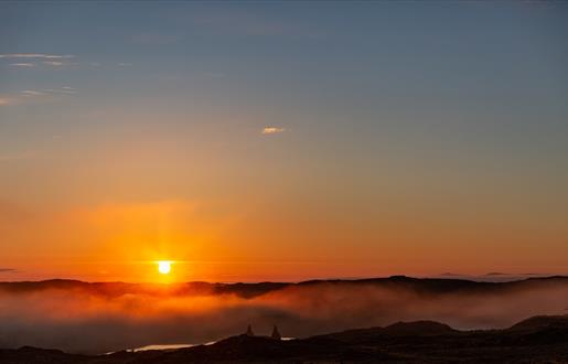 Long Island Retreats sunrise over misty loch