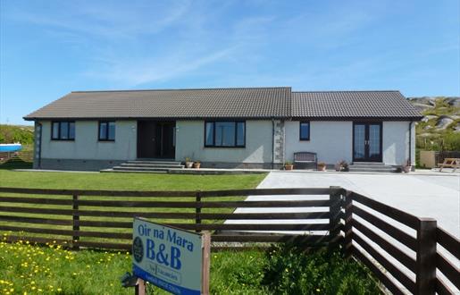 Oir Na Mara house & blue sky