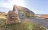 Finsbay Lodges with sunshine behind