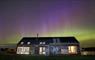 northern lights over longhouse
