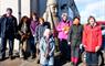 Group of Outer Hebrides Guides with a Berserker a large replica of one of the Lewis Chessmen