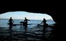 Surf Lewis canoeing in a cave