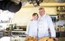 Scarista House owners on kitchen with fresh bread