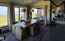 The Tidal Dwelling dining table with loch view