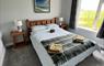 Bedrooms 1 and 2 with natural rustic pine beds. Views across the crofting landscape.
