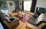 Living room with open views over the Hebridean landscape with the Haskeir Islands in the distance