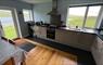 Fully furnished modern kitchen with stunning views across Loch Hosta and the hills beyond.