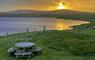 Morning view from the kitchen window watching the sun come up over the loch