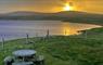 Morning view from the kitchen window watching the sun come up over the loch