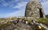 The Hebridean Mustard Company selection of mustard jars on rocks with cairn in the background