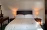 Upstairs bedroom, double bed, with white linen and antique furniture