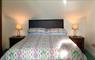 Upstairs bedroom, double bed, with white linen and antique furniture