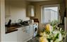 Uist Travel Accommodation kitchen & yellow flowers