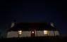 Glaic Cottage at night with stars.