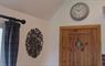 Inside Glaic Cottage, the door and clock.