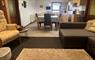 Kitchen view with family living space and dining table