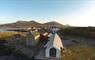 Aerial photo of the Taigh Chearsabhagh building, looking towards Lochmaddy Pier and Lee.