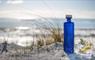 Eat Drink Hebrides - North Uist Distillery blue gin bottle & glass on sand