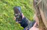Lady looking at site on phone app