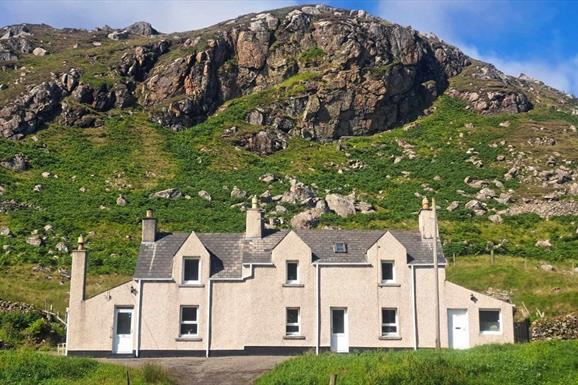 Cliff Cottage with hill in background
