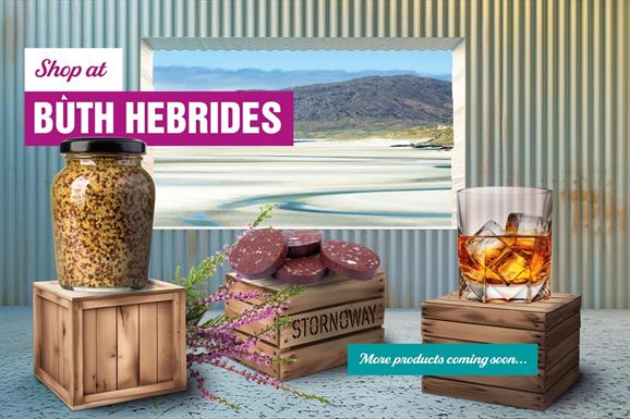Buth Hebrides image of products in shop with a window of a view of the beach