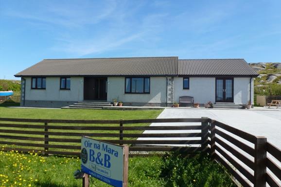 Oir Na Mara house & blue sky