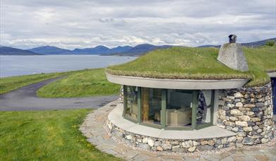 Blue Reef Cottages stone house with grass roof