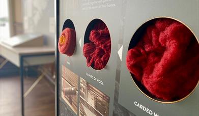 The Harris Tweed® Story Room stages to make yarn