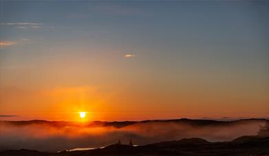 Long Island Retreats sunrise over misty loch